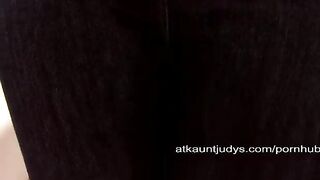 A mature woman masturbating her pussy on the couch with passion