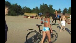 Nudists have fun on the beach without any clothes