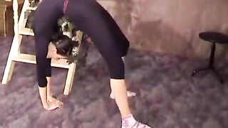 The guy stretched the flexible gymnast with passion