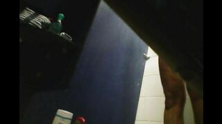 A hidden camera in the shower captured a girl with a shaved pussy