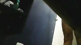 A hidden camera in the shower captured a girl with a shaved pussy