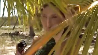 A couple has fun on the beach, indulging in adventurous and passionate acts