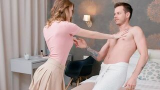 A pair of naked lovers are having a conversation on the bed
