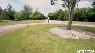 A couple is having fun in the park and they are not bored anymore