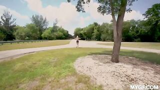 A couple is having fun in the park and they are not bored anymore