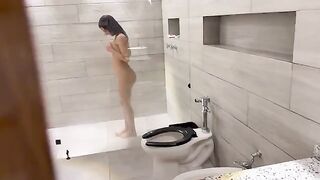 A beautiful Venezuelan showering, showcasing passion and allure in the steamy scene