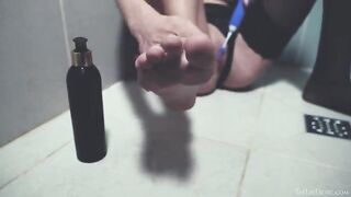 In the shower, alone and indulging with a toy