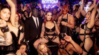 Sexual games on the playground for a group of people wearing latex