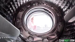 A girl was helped by a guy while the washing machine was vibrating