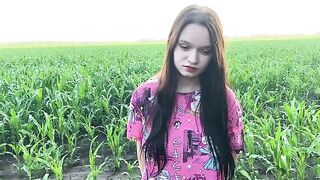 A sexy girl is having fun with a farmer in the field