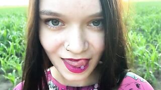 A sexy girl is having fun with a farmer in the field
