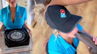The girl received a big black pizza and her face was covered with cream