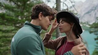 A couple makes love in the forest, overwhelmed by sensory experiences