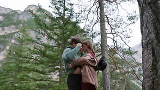 A couple makes love in the forest, overwhelmed by sensory experiences