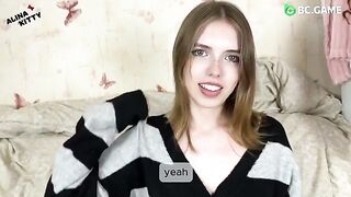 An almost naked girl is playing with a boy in the kitchen, teasing him