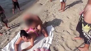 A towel spread on the beach, unbuttoned pants followed