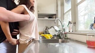 The sexy brunette has sex with her husband in the kitchen