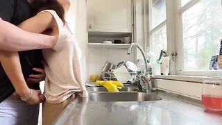 The sexy brunette has sex with her husband in the kitchen
