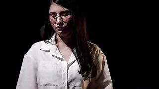 A girl caresses herself on the couch, and then her face contorts in orgasm