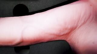 A girl caresses herself with a dildo, moaning and groaning in orgasmic pleasure