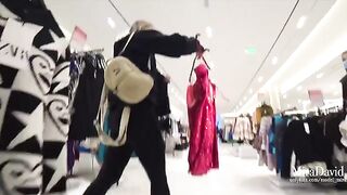 A girl caressed a guy’s cock in the fitting room and almost got caught